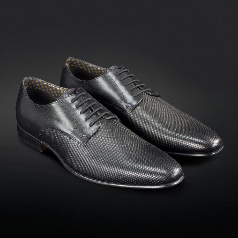 Black No-Tie shoelaces specifically made for dress shoes. Allowing you to  turn classic dress shoes into slip-ons while looking the exact same.